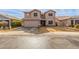 Two-story house with a large garage and landscaped yard at 11163 W Elm Ln, Avondale, AZ 85323