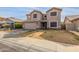 Two-story house with a large garage and landscaped yard at 11163 W Elm Ln, Avondale, AZ 85323