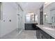 Spa-like bathroom with walk-in shower and granite countertops at 11618 W Levi Dr, Avondale, AZ 85323