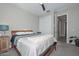 Cozy bedroom with wooden frame bed and ceiling fan at 11618 W Levi Dr, Avondale, AZ 85323