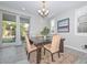 Bright dining area with seating for four and view of backyard at 11618 W Levi Dr, Avondale, AZ 85323