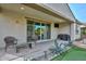 Relaxing covered patio with seating and putting green at 11618 W Levi Dr, Avondale, AZ 85323