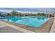 Community swimming pool with lounge chairs at 11618 W Levi Dr, Avondale, AZ 85323