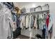 Well-organized closet with hanging clothes and shelves at 1255 N Arizona Ave # 1341, Chandler, AZ 85225