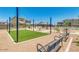 Relaxing community area with artificial turf and benches at 1255 N Arizona Ave # 1341, Chandler, AZ 85225