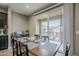 Dining area with a wooden table and sliding glass doors to a balcony at 1255 N Arizona Ave # 1341, Chandler, AZ 85225