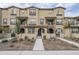 Three-story townhome with front yard landscaping and walkway at 1255 N Arizona Ave # 1341, Chandler, AZ 85225