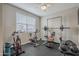 Home gym with spin bikes, weights, and workout bench at 1255 N Arizona Ave # 1341, Chandler, AZ 85225