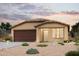 Single story home with two car garage and desert landscaping at 1425 W Hopi Dr, Coolidge, AZ 85128