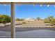 Covered patio overlooking a spacious backyard at 14812 W Las Brizas Ln, Sun City West, AZ 85375