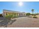 Landscaped backyard with gravel and mature trees at 14812 W Las Brizas Ln, Sun City West, AZ 85375