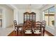 Dining room with a wood table and chairs, and a view to the kitchen at 14812 W Las Brizas Ln, Sun City West, AZ 85375