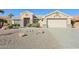 Single-story house with a two-car garage and desert landscaping at 14812 W Las Brizas Ln, Sun City West, AZ 85375