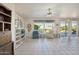 Living room with tile floors, large windows, and comfortable furniture at 14812 W Las Brizas Ln, Sun City West, AZ 85375