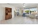 Living room with built-in shelving, large windows, and comfortable seating at 14812 W Las Brizas Ln, Sun City West, AZ 85375