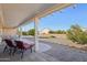 Relaxing patio with seating area and view of backyard at 14812 W Las Brizas Ln, Sun City West, AZ 85375