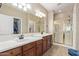 Double vanity bathroom with a large walk-in shower at 1577 E Laurel Dr, Casa Grande, AZ 85122