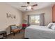 Cozy bedroom featuring a comfortable bed and work space at 1577 E Laurel Dr, Casa Grande, AZ 85122