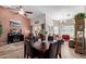 Bright dining area features a spacious table with leather chairs, and large windows at 1577 E Laurel Dr, Casa Grande, AZ 85122