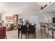 Elegant dining area with a dark wood table and leather chairs, near kitchen at 1577 E Laurel Dr, Casa Grande, AZ 85122