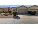 Charming house with a two-car garage and desert landscaping at 1577 E Laurel Dr, Casa Grande, AZ 85122