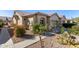 Spanish style home with walkway and drought-tolerant landscaping at 1577 E Laurel Dr, Casa Grande, AZ 85122