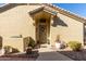 Front door entrance with a decorative wreath and potted plants at 1577 E Laurel Dr, Casa Grande, AZ 85122