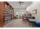 Well-stocked library with bookshelves and a reading area at 1577 E Laurel Dr, Casa Grande, AZ 85122