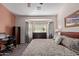 Large main bedroom with bay window, dresser, and king-size bed at 1577 E Laurel Dr, Casa Grande, AZ 85122