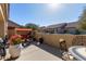 Spacious patio with seating area, planters, and a grill at 1577 E Laurel Dr, Casa Grande, AZ 85122