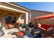 Relaxing patio features comfortable seating and a covered area at 1577 E Laurel Dr, Casa Grande, AZ 85122