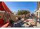 Covered patio with seating and a swing at 1577 E Laurel Dr, Casa Grande, AZ 85122