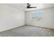 Simple bedroom with neutral walls, ceiling fan, and carpeting at 15857 W Yavapai St, Goodyear, AZ 85338