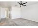 Bright bedroom featuring a ceiling fan and sliding door at 15857 W Yavapai St, Goodyear, AZ 85338