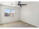 Well-lit bedroom with ceiling fan and window at 15857 W Yavapai St, Goodyear, AZ 85338