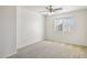 Neutral bedroom with plush carpeting and ceiling fan at 15857 W Yavapai St, Goodyear, AZ 85338