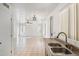 Kitchen with double sink and tile flooring at 15857 W Yavapai St, Goodyear, AZ 85338