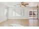 Bright living room with tile floors and sliding glass doors at 15857 W Yavapai St, Goodyear, AZ 85338