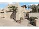 Tan stucco house with a two-car garage and gated entry at 16615 N 30Th Ave, Phoenix, AZ 85053