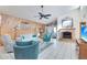 Living room with wood-paneled accent wall and fireplace at 16615 N 30Th Ave, Phoenix, AZ 85053