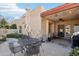 Outdoor patio with table, chairs, and a gas grill at 16615 N 30Th Ave, Phoenix, AZ 85053