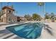 Community pool with lounge chairs and covered seating area at 16615 N 30Th Ave, Phoenix, AZ 85053