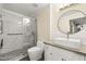 Stylish bathroom featuring a glass shower enclosure, round mirror, and modern square sink on vanity at 1701 E Colter St # 223, Phoenix, AZ 85016