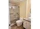 Modern bathroom with walk-in shower, gray tile, and floating vanity at 1701 E Colter St # 223, Phoenix, AZ 85016