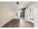 Bright bedroom featuring wood floors, ceiling fan, and access to a private balcony with sliding glass doors at 1701 E Colter St # 223, Phoenix, AZ 85016