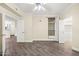 Bright bedroom with wood flooring leading to bathroom and kitchen with multiple doors at 1701 E Colter St # 223, Phoenix, AZ 85016