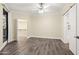Inviting bedroom with vinyl floors, ceiling fan, closet, and an adjoining bathroom at 1701 E Colter St # 223, Phoenix, AZ 85016