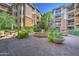 Beautiful courtyard with fountain, lush landscaping, and seating at 1701 E Colter St # 223, Phoenix, AZ 85016