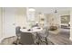 Dining area flows into a well-lit living room and showcases stylish decor and neutral color palette at 1701 E Colter St # 223, Phoenix, AZ 85016