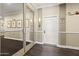 Hallway with neutral color palette, dark wood style flooring, and contemporary lighting at 1701 E Colter St # 223, Phoenix, AZ 85016